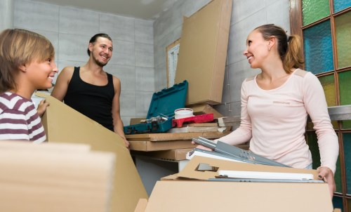 Removal team planning a house move in New Cross with boxes and furniture ready for loading