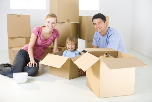 Professional movers handling furniture in a New Cross flat move
