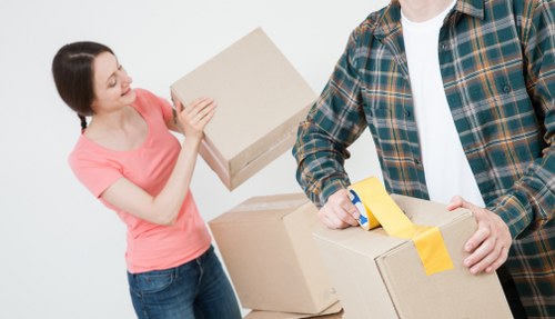 Packing and loading household items into a moving van