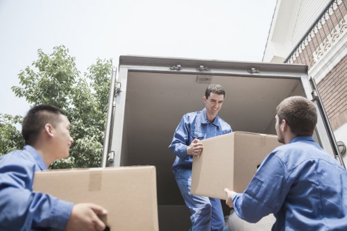 Furniture and boxes prepared for transport by removal van