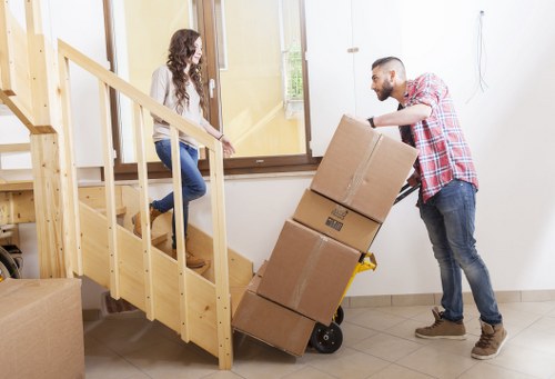Commercial removals team handling desks and files in New Cross